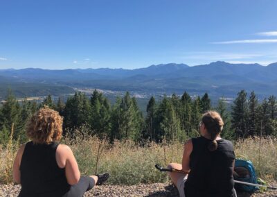 two women friends mountain landscape